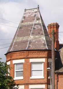 Note on the left picture, the craftsmanship of the slate roof and brick chimneys.