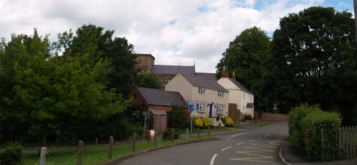 The Sunday peace and quiet of Tugby village with the church up on the hill in the background, Leicestershire, England.