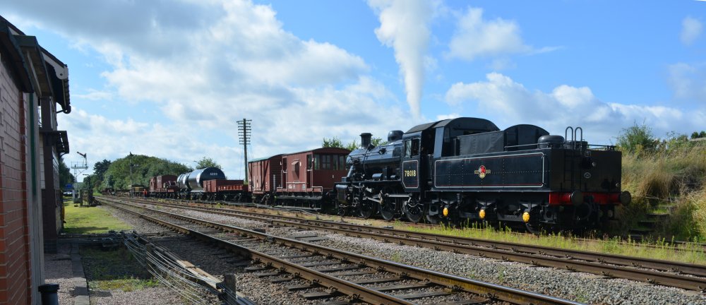 Ex BR standard 2-6-0 2MT steam locomotive 78018, heading north approaching Quorn and Woodhouse station with a demonstration freight train, Great Central Railway heritage weekend 'Railways at Work' (GCR August 2023)