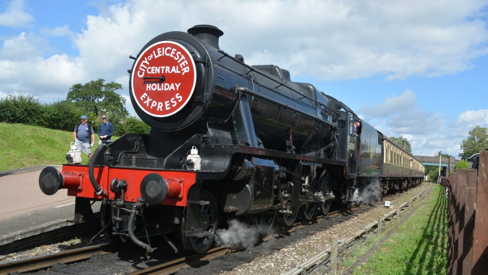 The CITY of LEICESTER CENTRAL HOLIDAY EXPRESS hauled by steam locomotive 48305 waiting to depart from Quorn and Woodhouse station with a Loughborough to Leicester passenger service, Great Central Railway heritage weekend Gala 'Railways at Work' (GCR August 2023)