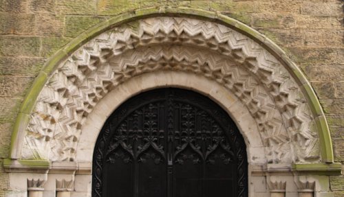 The richly carved Norman north door arch of St Mary de Castro, Leicester.