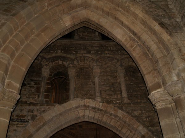 Some of the early 12th century windows in the south-east wall of the nave near the tower. The internal architecture of St Mary de Castro Church, City of Leicester, England, English Midlands