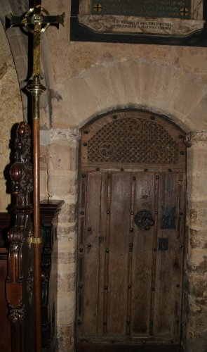 An old richly carved oak wooden door. The internal architecture of St Mary de Castro Church, City of Leicester, England, English Midlands