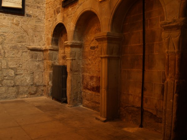 Finely carved Romanesque arches set into the west wall, some of the oldest stonework in the church. The internal architecture of St Mary de Castro Church, City of Leicester, England, English Midlands