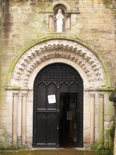 The richly carved Norman north door arch of St Mary de Castro, Leicester.