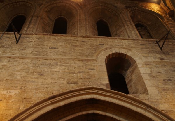 Some of the early 12th century windows in the south-east wall of the nave near the tower. The internal architecture of St Mary de Castro Church, City of Leicester, England, English Midlands