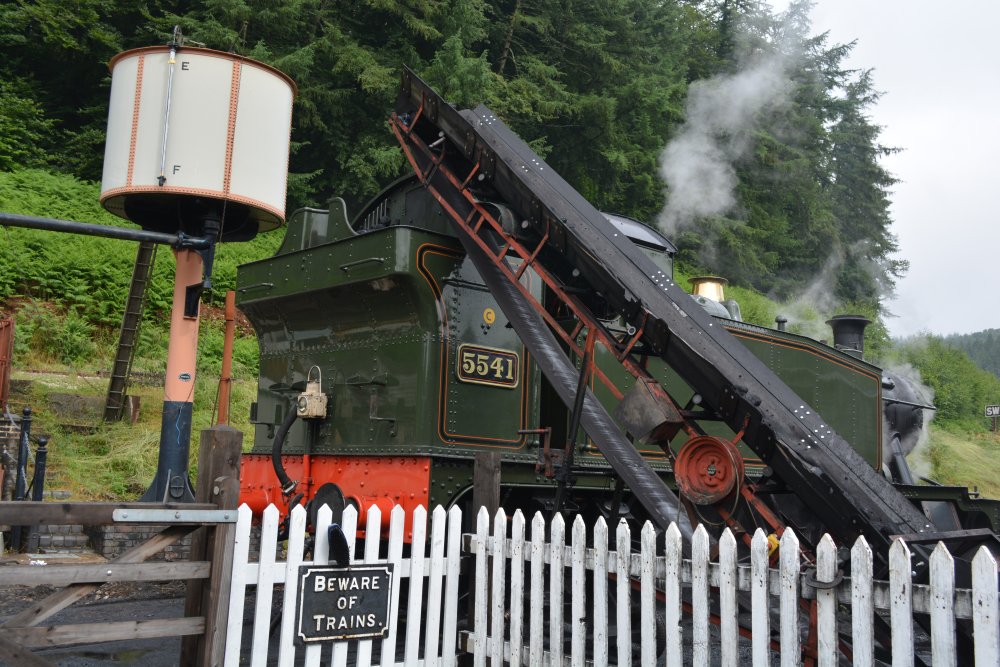 Coaling up GWR tank steam locomotive 5541 at Norchard Dean Forest Railway Gloucestershire England