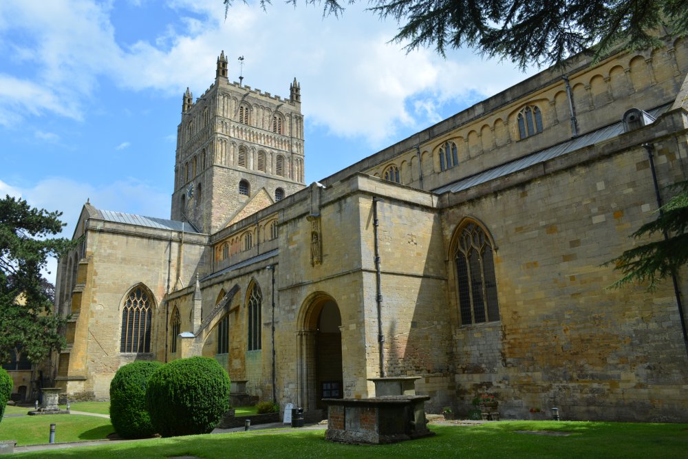 Entrance door and exterior view of the north aisle of Tewkesbury Abbey Gloucestershire England
