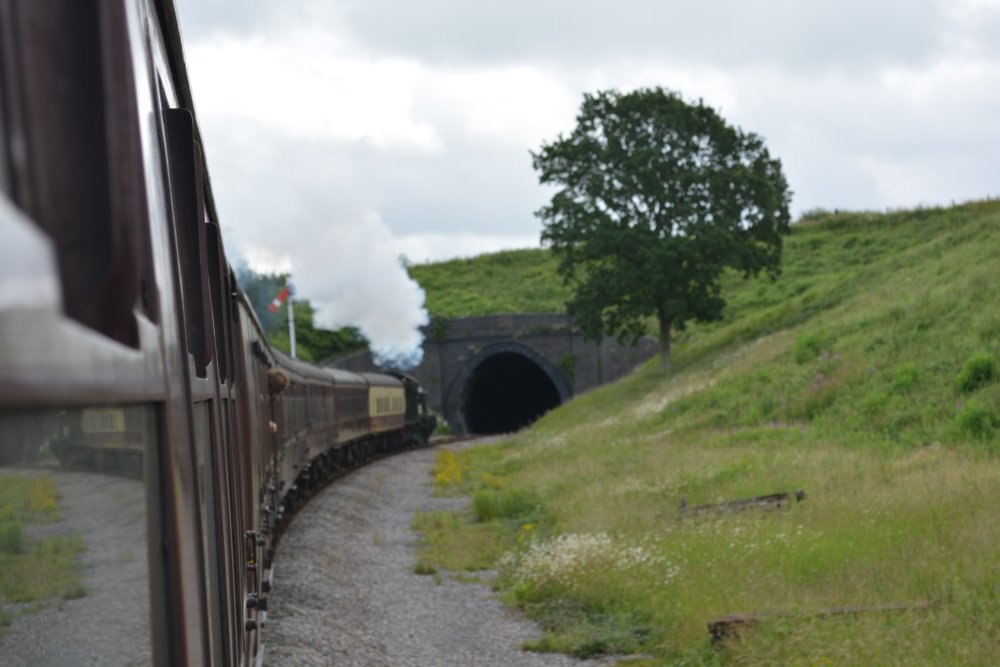 train entering Greet Tunnel between Gotherington and Winchcombe Gloucestershire Warwickshire steam railway England