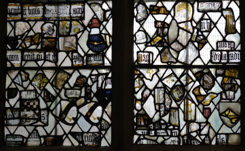 Fragments from medieval stained glass panels in the North Aisle of the Chancel of Great Malvern Priory Church Worcestershire England
