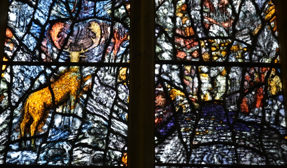details of the modern stained glass  Millennium Window by the artist Thomas Denny Great Malvern Priory Church Worcestershire England