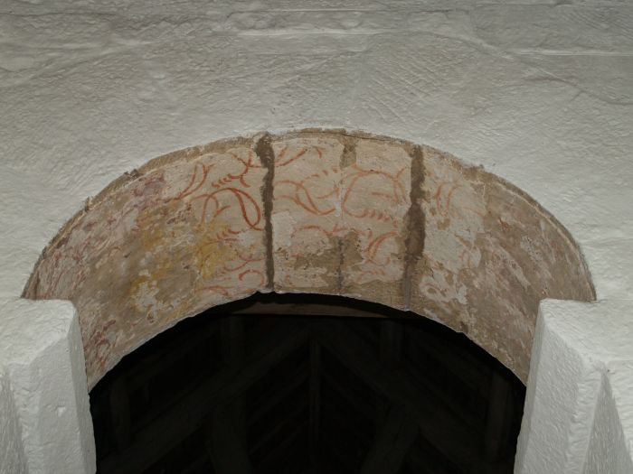 A 12th century fresco on the chancel arch which is probably Roman in origin.