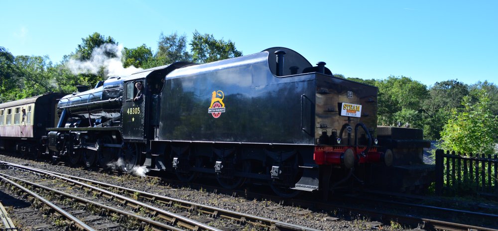Entering Grosmont station with a passenger train from Pickering, Stanier 8F 2-8-0 freight locomotive BR 48305, (NYMR Steam Gala September 2021)