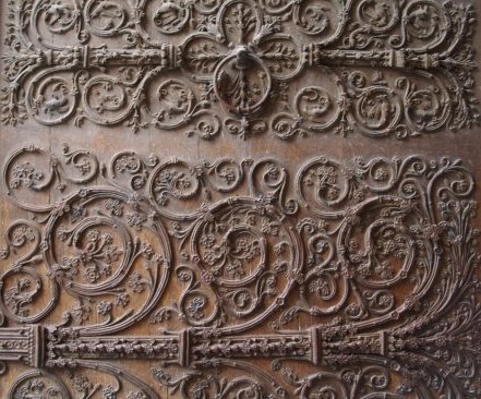 The exquisite wooden carving on the great central west entrance door of Notre Dame.