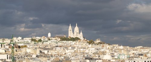 The Romano-Byzantine styled Church of Sacre-Coeur on Montmartre Hill, viewed from the roof of Galeries Lafayette.