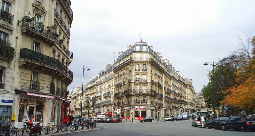 Typical streets of blocks of upper apartments and shops at ground level.