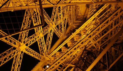 Descending by the 'stairs' and admiring the floodlit pig-iron girders of the Eiffel Tower carefully to not miss a step while admiring the great structure!