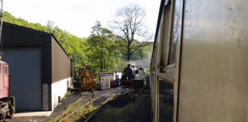 Leaving Pickering, passing the engine shed where a steam locomotive is being prepared for the first steam hauled Pickering-Grosmont train of the day.