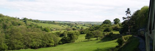 Passing through rolling green hills and farmland as Grosmont is approached.