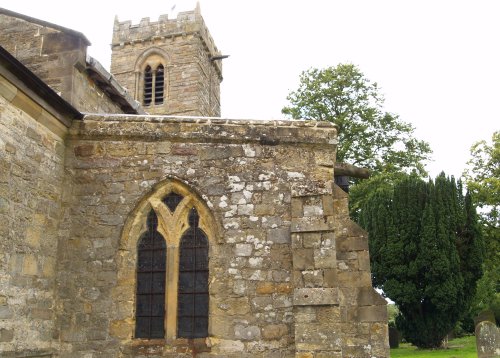 The north-east view of the church and the particularly weathered stonework
