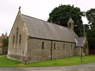 The relatively 'modern' church of St John the Baptist contains a Norman Font and some interesting carved Saxon stones from the abandoned medieval church of Levisham, North York Moors, North Yorkshire, England.