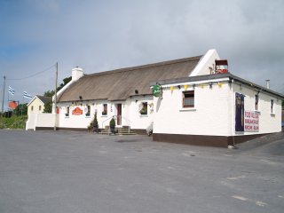 The Thatch Bar is across the road from Granagh/Granny Castle on the Waterford to Carrick-on-Suir road in Co. Kilkenny The Thatch Bar is across the road from Granagh/Granny Castle on the Waterford to Carrick-on-Suir road in Co. Kilkenny