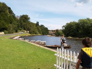 Boats above the weir - Ruswarp on the River Esk near Whitby, North Yorkshire, Northern England