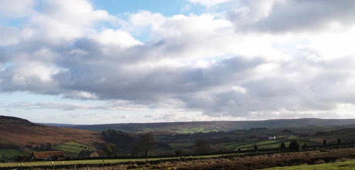 Castleton village on the ridge of the road up to Blakey, viewed from the Castleton-Commondale road