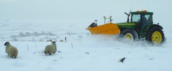Clearing the snow above Castleton to the consternation of the sheep