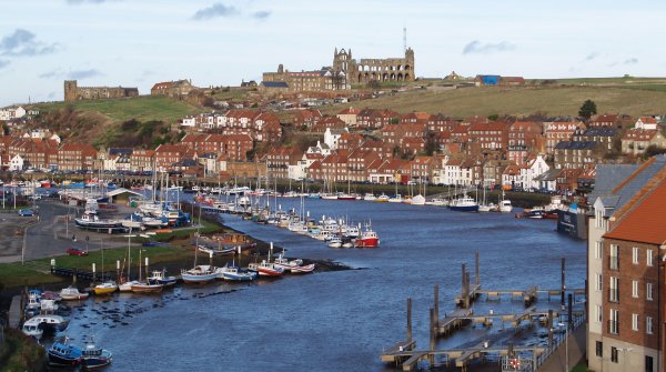 The harbour, boats, east-side houses, St Mary's Church and Whitby Abbey from the Scarborough road bridge