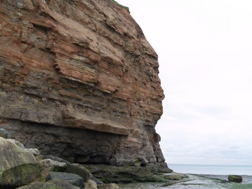 The weathered and sea battered sedimentary rock layers of the north east cliff head.