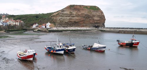 Moored fishing cobbles-boats in the harbour.
