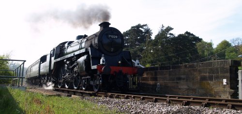 The North Yorkshire Moors Railway are allowed to run a few Grosmont-Battersby steam trains in the summer. Here steam locomotive 75029 is heading out of Castleton for Grosmont.
