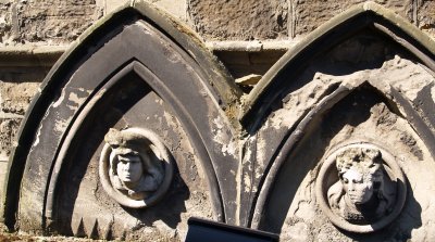Stone carved heads on the side of Bagdale Hall
