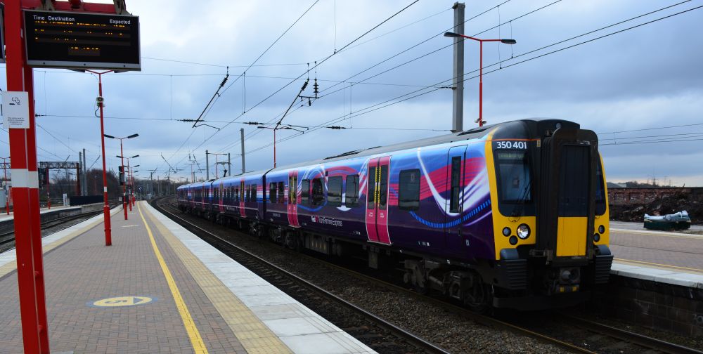 trainspotting at Wigan North Western Station Entering Wigan North Western station, a TransPennine Class 350 with a Manchester Airport to Edinburgh service