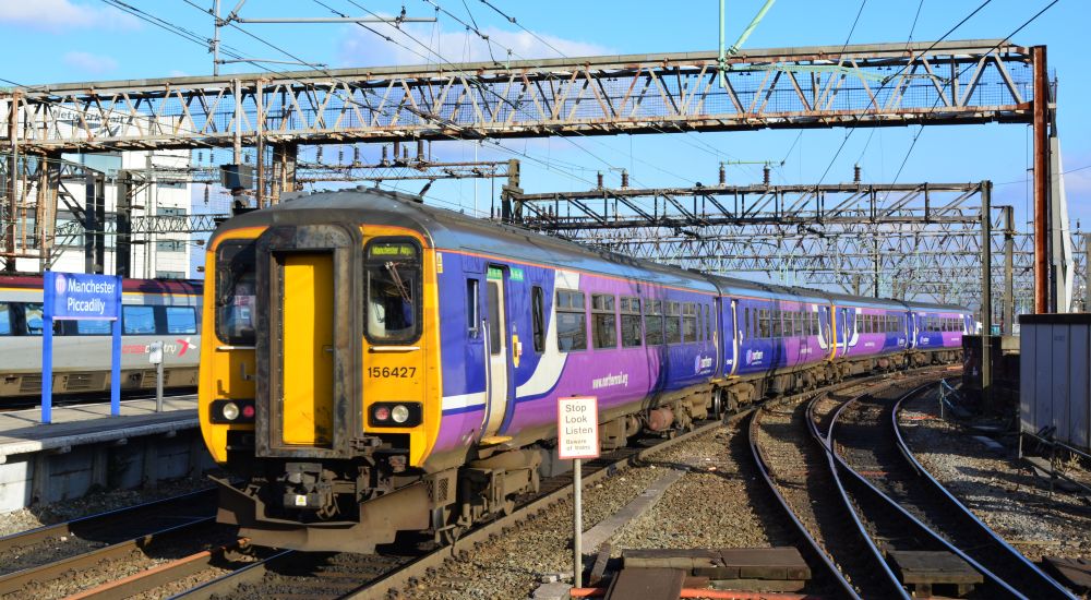 DMU Class 156 156427 leaving Manchester Piccadilly Station with a train for Manchester Airport (March 2016)