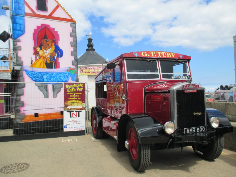 An old SCAMMELL wagon registration number AMR 600 used for towing fairground rides by the Beachside Cafe and funfair at the start of Whitby's west pier.