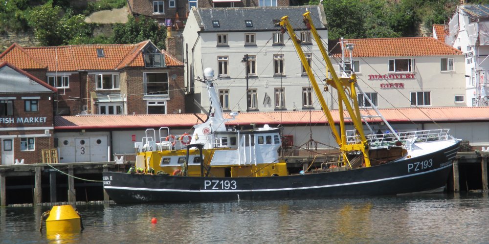 Fishing boat PZ 193 TREVESSA IV (registered at Penzance, Cornwall) moored up in Whitby Harbour by the Fish Market below West Cliff.