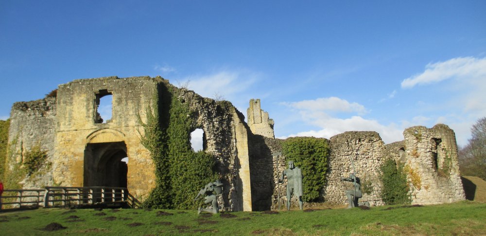 The south gate entrance to Helmsley Castle and a triple sculpture of armed men Helmsley Castle, North Yorkshire