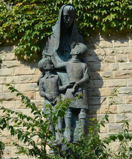 man/priest and two children sculpture Ampleforth Abbey North Yorkshire