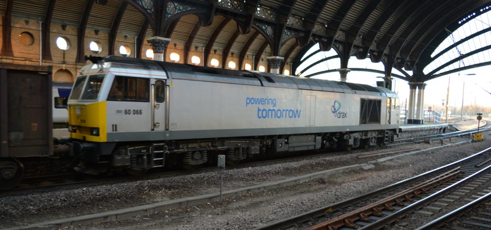 Class 60 diesel-electric locomotive 60066 leaving York heading north with a freight train of empty wagons.