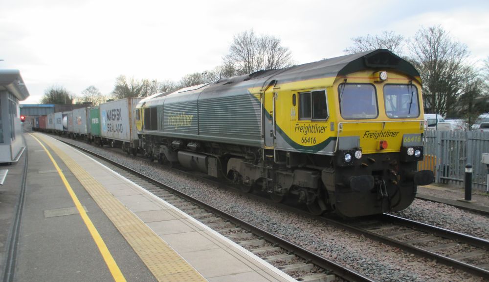 trainspotting at Peterborough Freightliner Class 66 diesel locomotive 66416 with a long intermodal freight train
