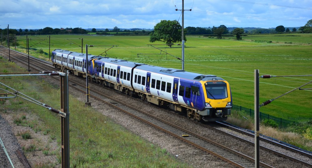 Trainspotting Colton Junction Class 195 DMU 195012 leading unidentified Class 195 with the Northern Rail 1018 service from York to Leeds trainspotting Colton Junction footbridge