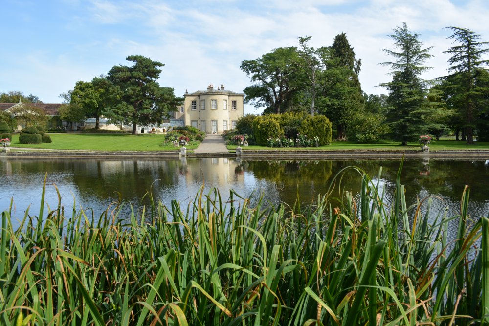 estate house and lake of Thorp Perrow Arboretum & Bird of Prey & Mammal Centre, North Yorkshire, England