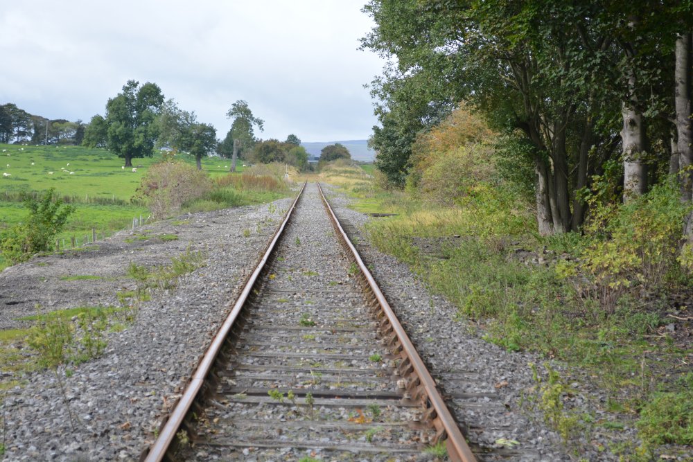 crossing over the wonderful heritage line of the Wensleydale Railway Leyburn Shawl Circular walk, North Yorkshire, England