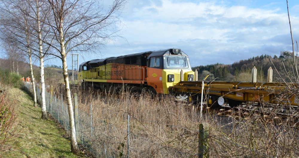 Colas Rail Freight Class 70 diesel locomotive 70815 pushing the track laying train along Relaying new track Network Rail Danby Castleton Moor Commondale 2020 Esk Valley Line