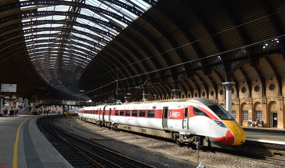 Class 801 EMU 801229 departing from York station platform 5 with an AZUMA LNER service to Edinburgh Waverley.