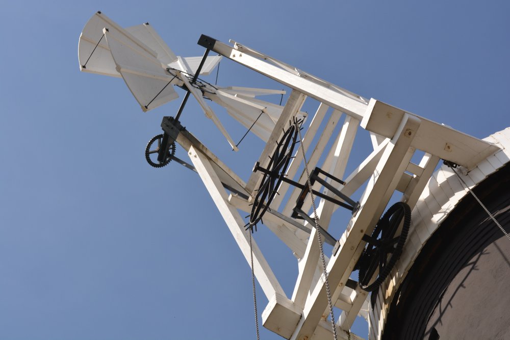 fantail mechanism on a windmill is a small windmill mounted at right angles to the sails, at the rear of the windmill turns the cap automatically to bring it into the wind Holgate Windmill, York