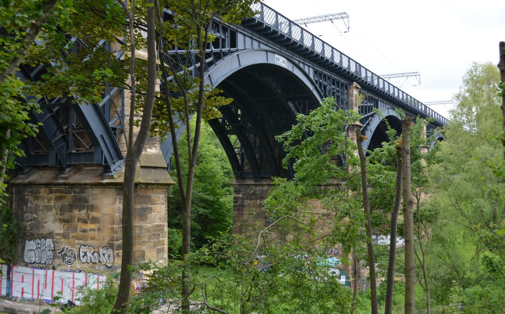 The massive iron arches and stone supports of the Ouseburn valley railway viaduct.