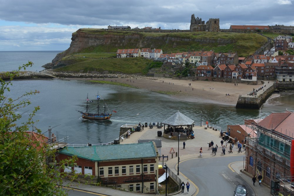 From West Cliff, a view of lower Whitby Harbour and across to the Abbey and St Mary's Church on the East Cliff.